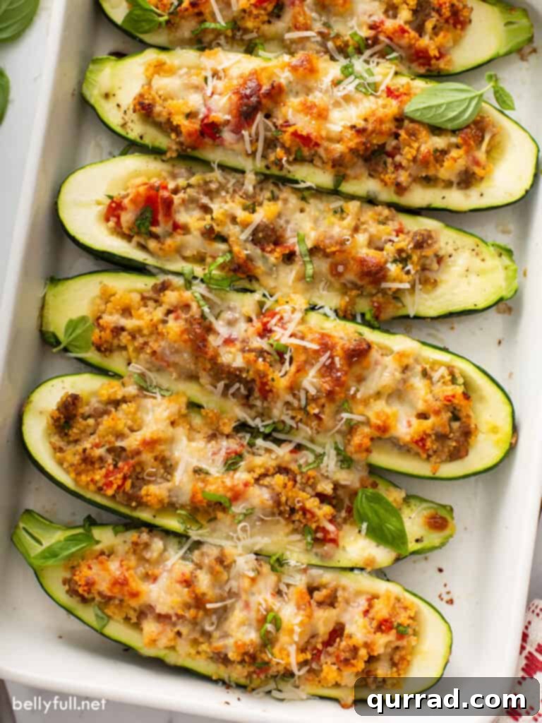 Hearty Italian Zucchini Boats 2 Italian stuffed zucchini in a white casserole dish