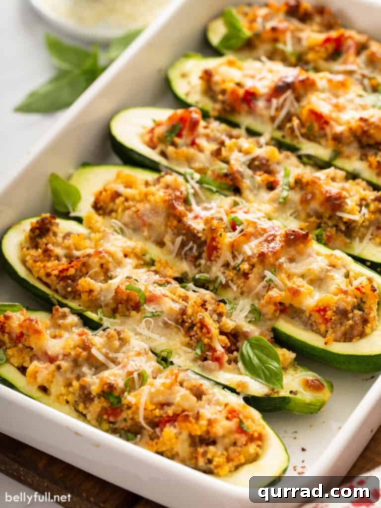 Hearty Italian Zucchini Boats 13 Several Italian stuffed zucchini boats beautifully arranged in a white casserole dish, ready to be served.