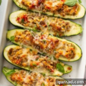 overhead stuffed zucchini boats in white casserole dish