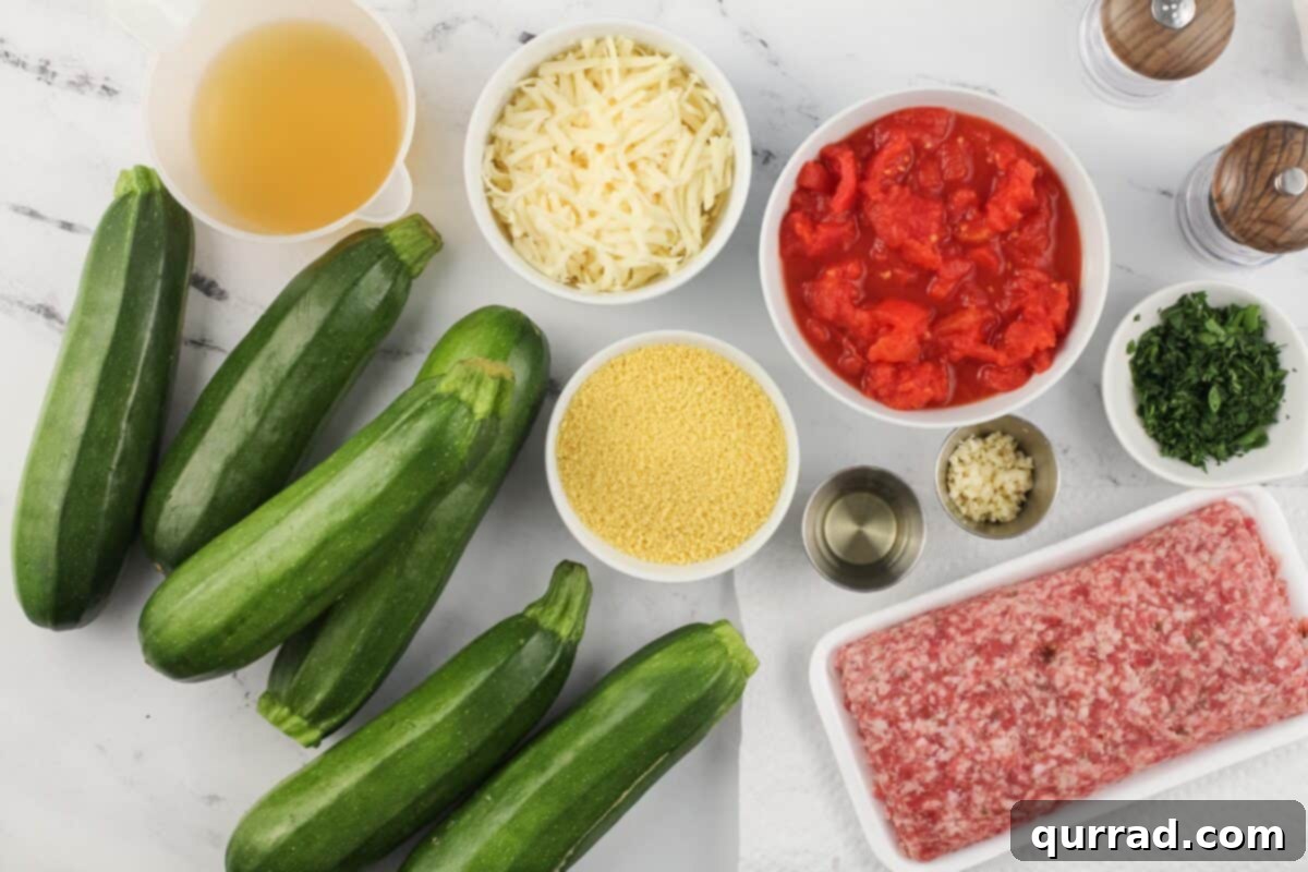 Hearty Italian Zucchini Boats 5 All ingredients laid out on a white surface for making Italian stuffed zucchini.