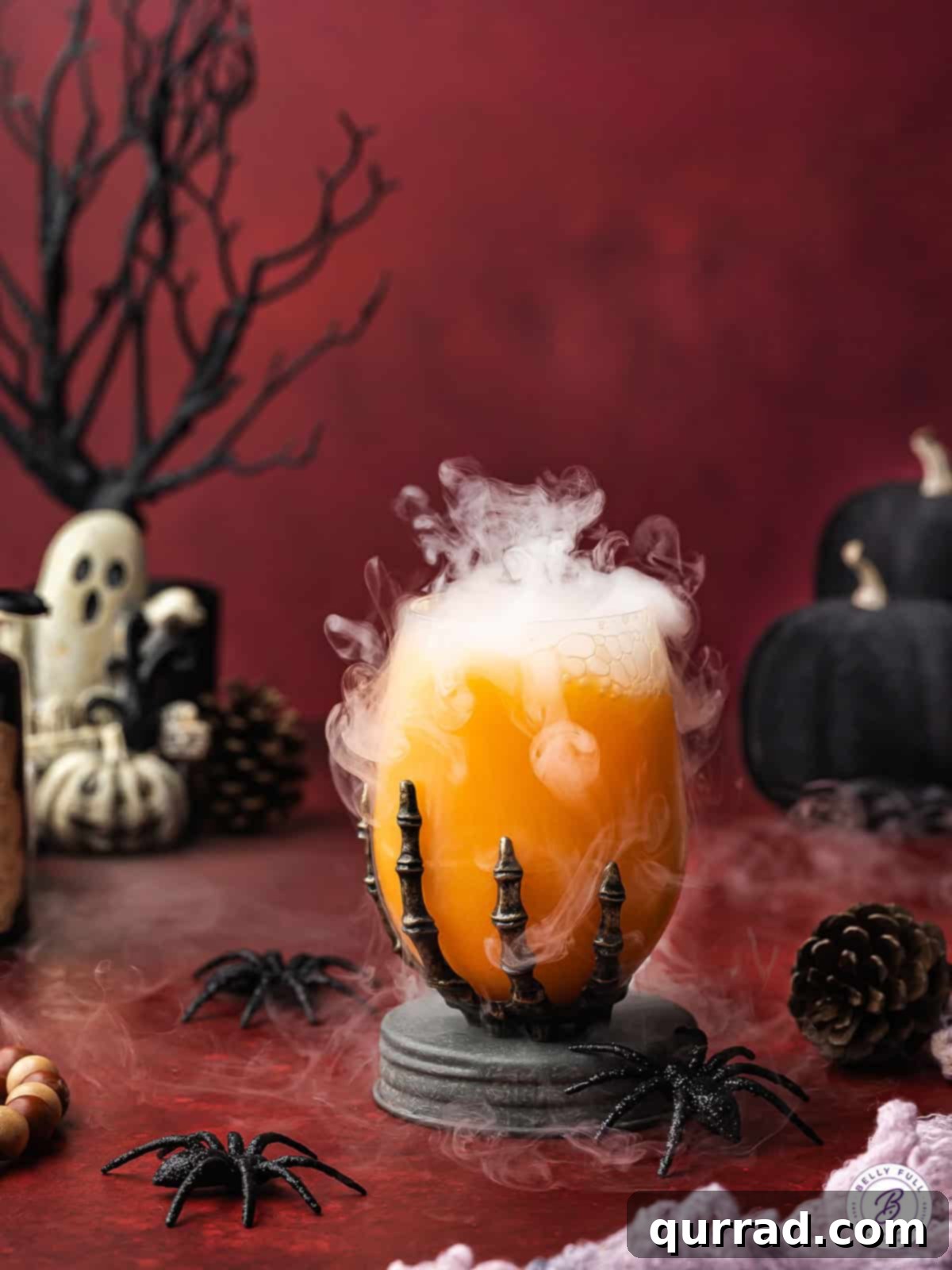 Enchanted Halloween Elixir 9 Halloween punch in a skeleton glass with dry ice fog effect