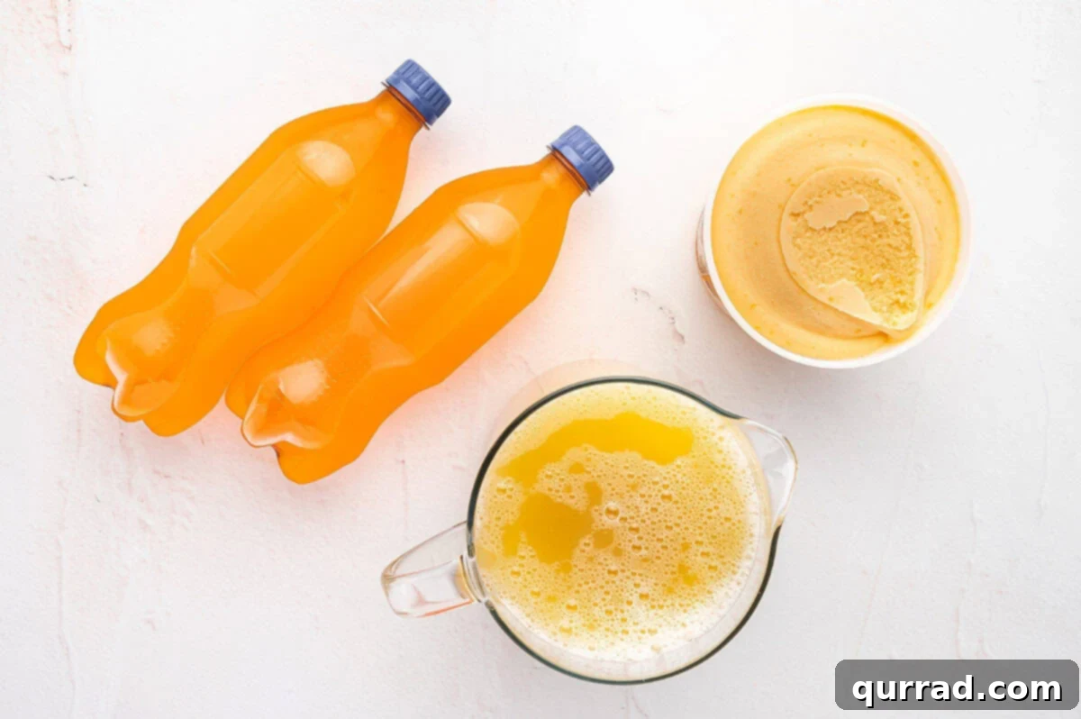Enchanted Halloween Elixir 3 Three key ingredients for Halloween Witches Brew punch: pineapple juice, orange sherbet, and orange soda