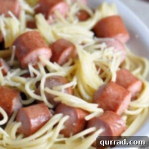 Threaded Spaghetti Hot Dog Bites - a delicious and easy kid-friendly meal where spaghetti is cooked right inside hot dog pieces, served with butter and cheese.