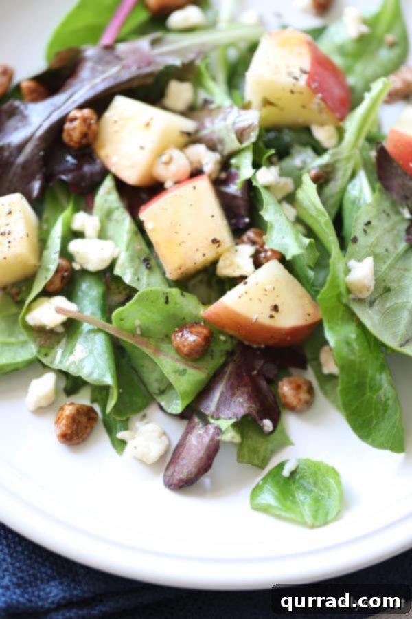 Fresh and Crisp Apple Salad Close-up view of fresh Apple Salad, highlighting the crisp apple pieces and pecans