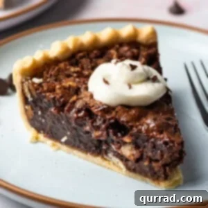 close up slice of chocolate pecan pie