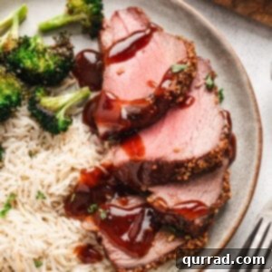 Sliced roasted Tri-Tip on plate with sauce, ready to be enjoyed