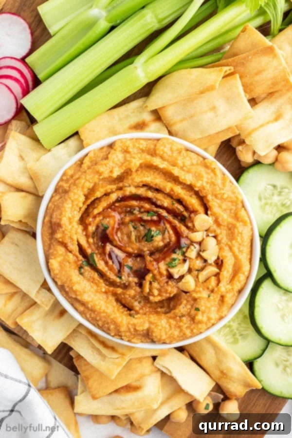 overhead of hummus in bowl with barbecue sauce