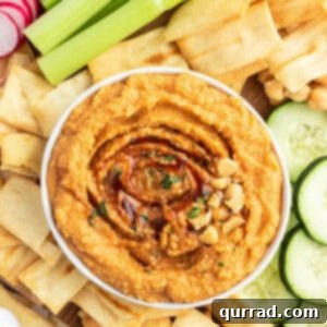 overhead of hummus in bowl with barbecue sauce
