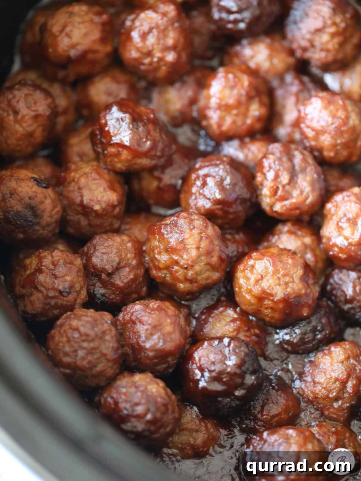 Crock-Pot Cranberry Glazed Meatballs 4 Overhead shot of slow cooker cranberry meatballs in a slow cooker, ready to be served.