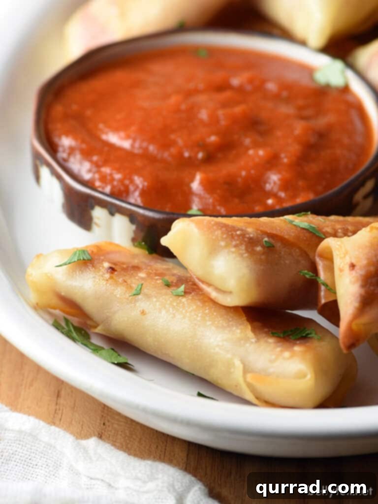 Crispy Salami Mozzarella Poppers 4 Platter of freshly baked salami mozzarella bites, garnished with parsley, served with marinara sauce for dipping.