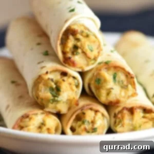 stack of baked chicken taquitos on white plate