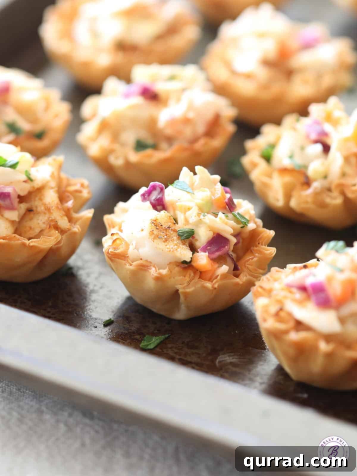 Crispy Mini Fish Tacos 4 Mini phyllo shells generously filled with baked fish and topped with a vibrant, creamy coleslaw.