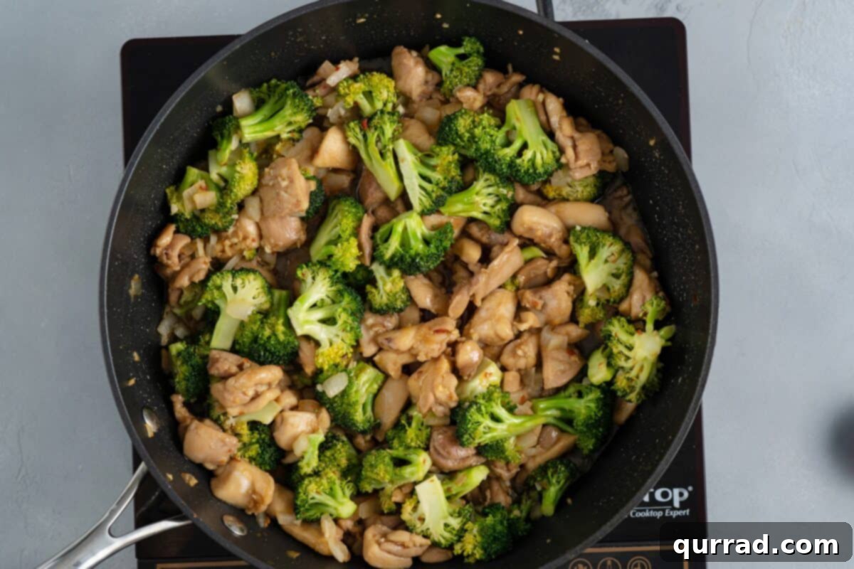 Savory Chicken and Broccoli Stir Fry 8 Cooked chicken and vegetables mixed together in the skillet.