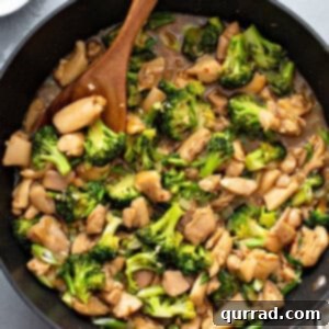overhead chicken broccoli stir fry in skillet