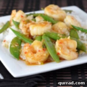 Close-up of a delicious and healthy Shrimp Stir-Fry with Sugar Snap Peas in a bowl, ready to serve over rice.