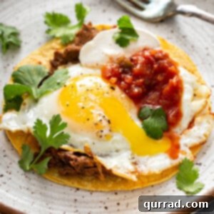 Huevos Rancheros on plate with fork