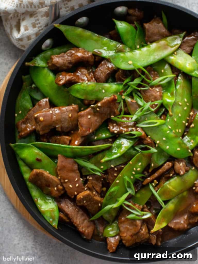 Sizzling Beef Stir Fry 2 close up overhead beef stir fry with snow peas in skillet