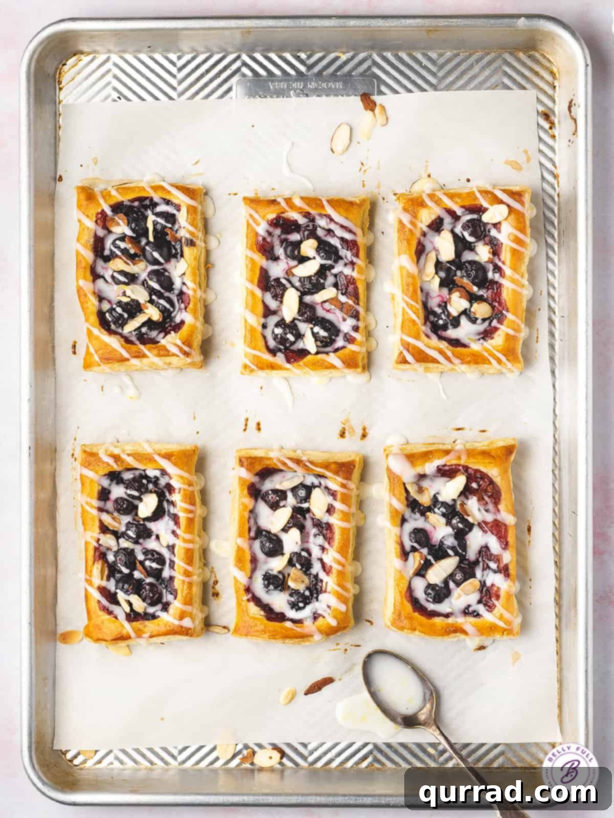 overhead rectangular blueberry pastry tarts on plates