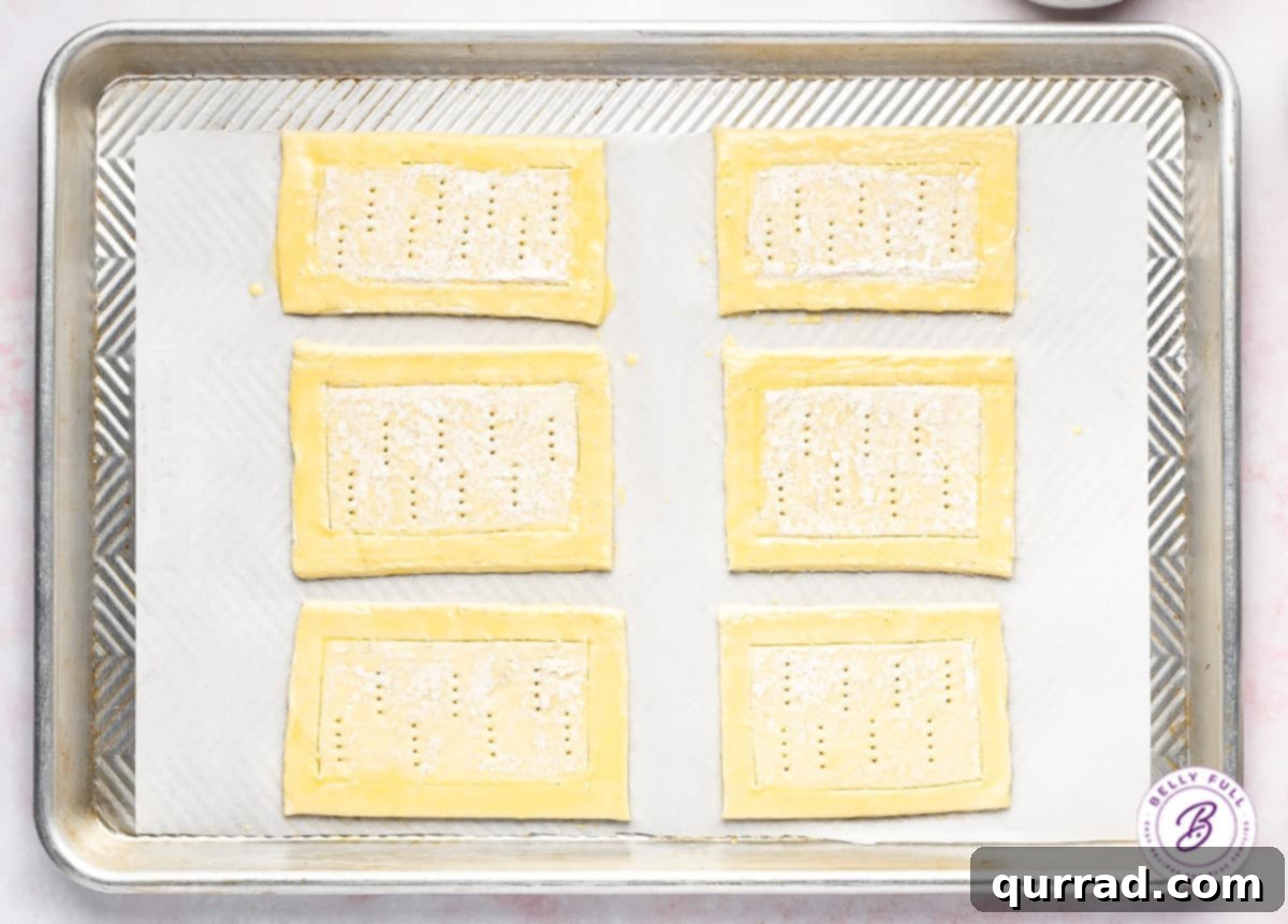 raw puff pastry rectangles with egg wash