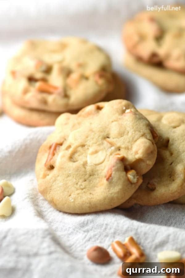 Sweet & Salty Pretzel Crunch Cookies with White Chocolate & Butterscotch 2 Soft, chewy cookies packed with white chocolate, butterscotch chips, and crunchy pretzel pieces. A delightful sweet and salty cookie recipe.