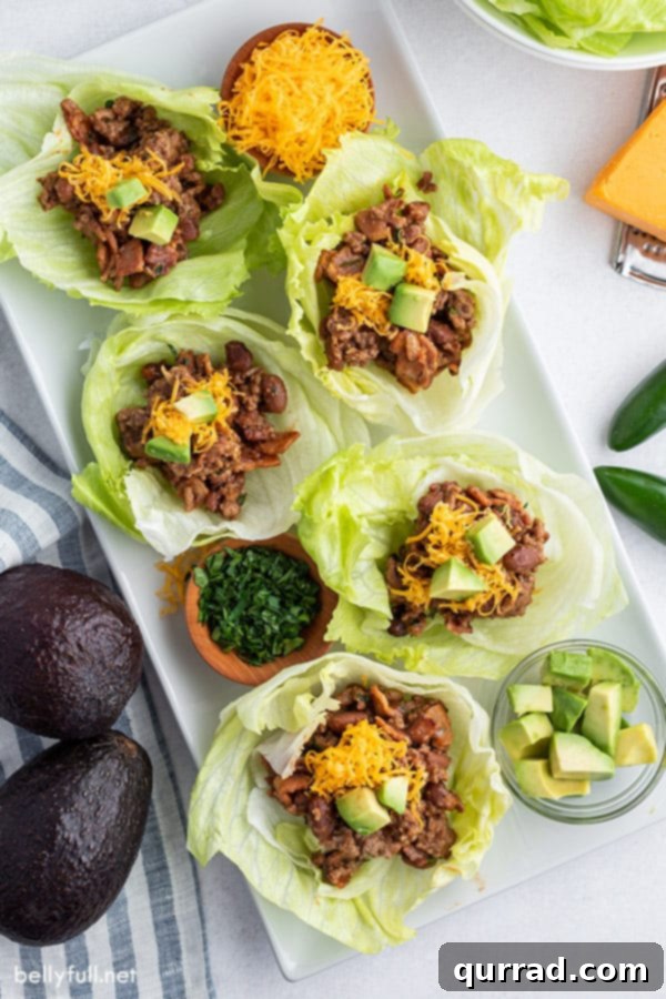 Fiesta Beef Lettuce Cups 3 overhead of 5 beef lettuce cups on white serving tray