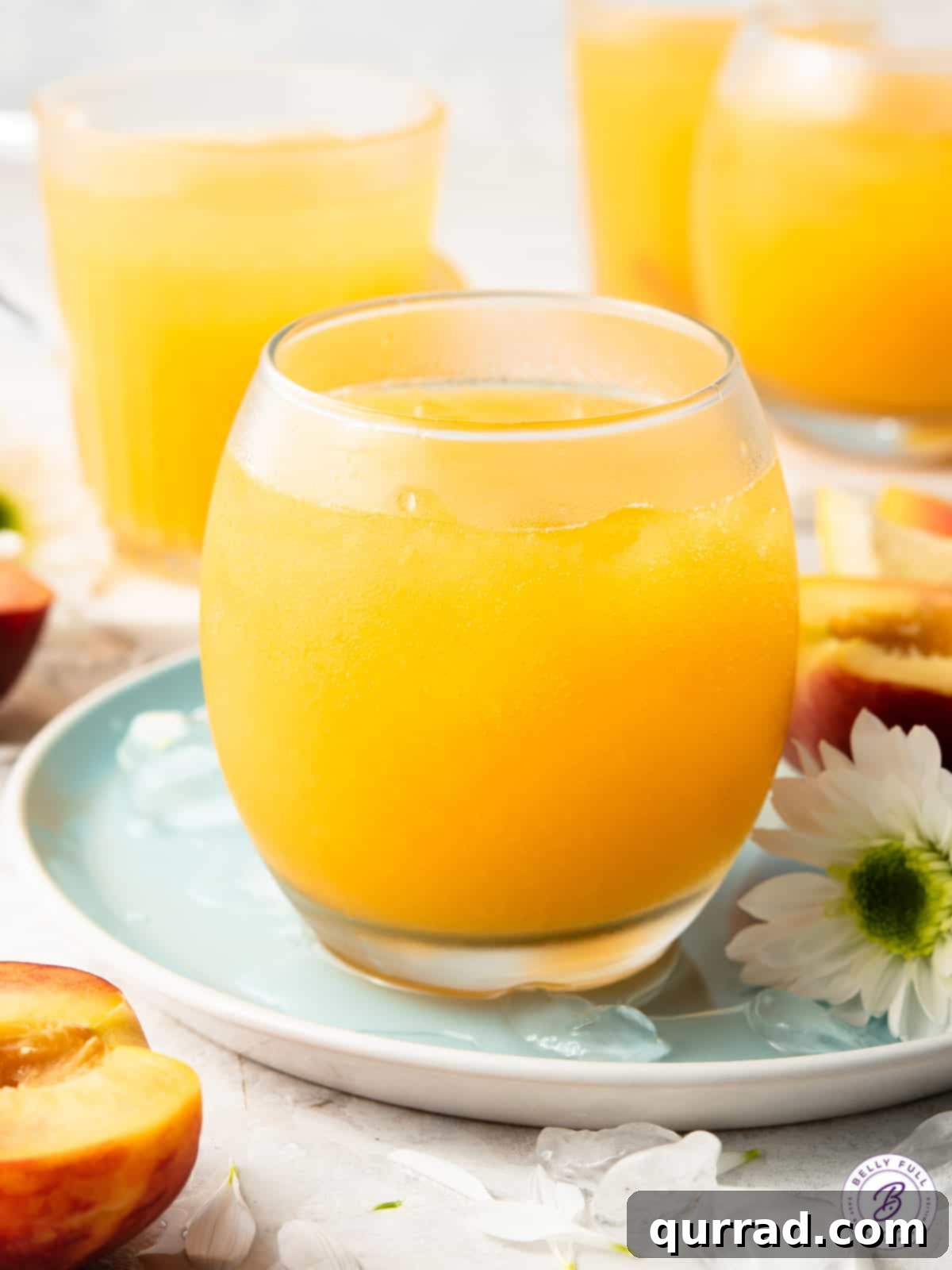 Sparkling peach cooler drink in a pitcher with glasses, perfect for sharing