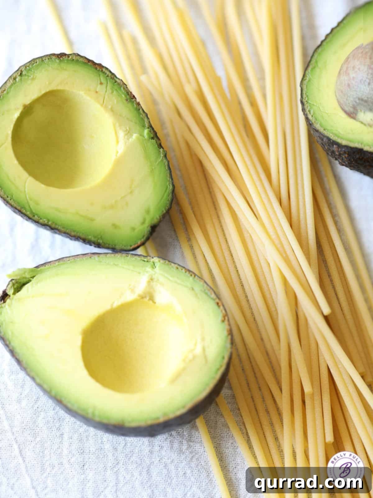 Velvety Avocado Pasta 3 2 avocado halves with raw spaghetti