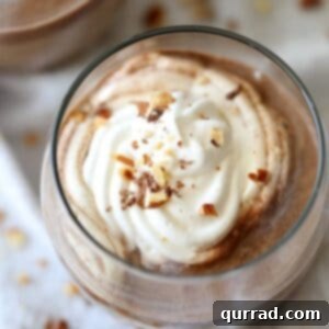 Frosted Nutella Latte 2 A refreshing Nutella Latte garnished with whipped cream and chocolate shavings.