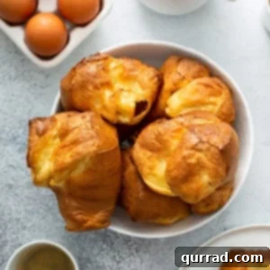 golden baked popovers piled in bowl