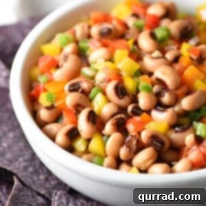 This Texas Caviar is a cross between a salad and a dip, made up of black-eyed peas and colorful bell peppers, lightly pickled in a vinaigrette dressing and served with blue corn tortilla chips!