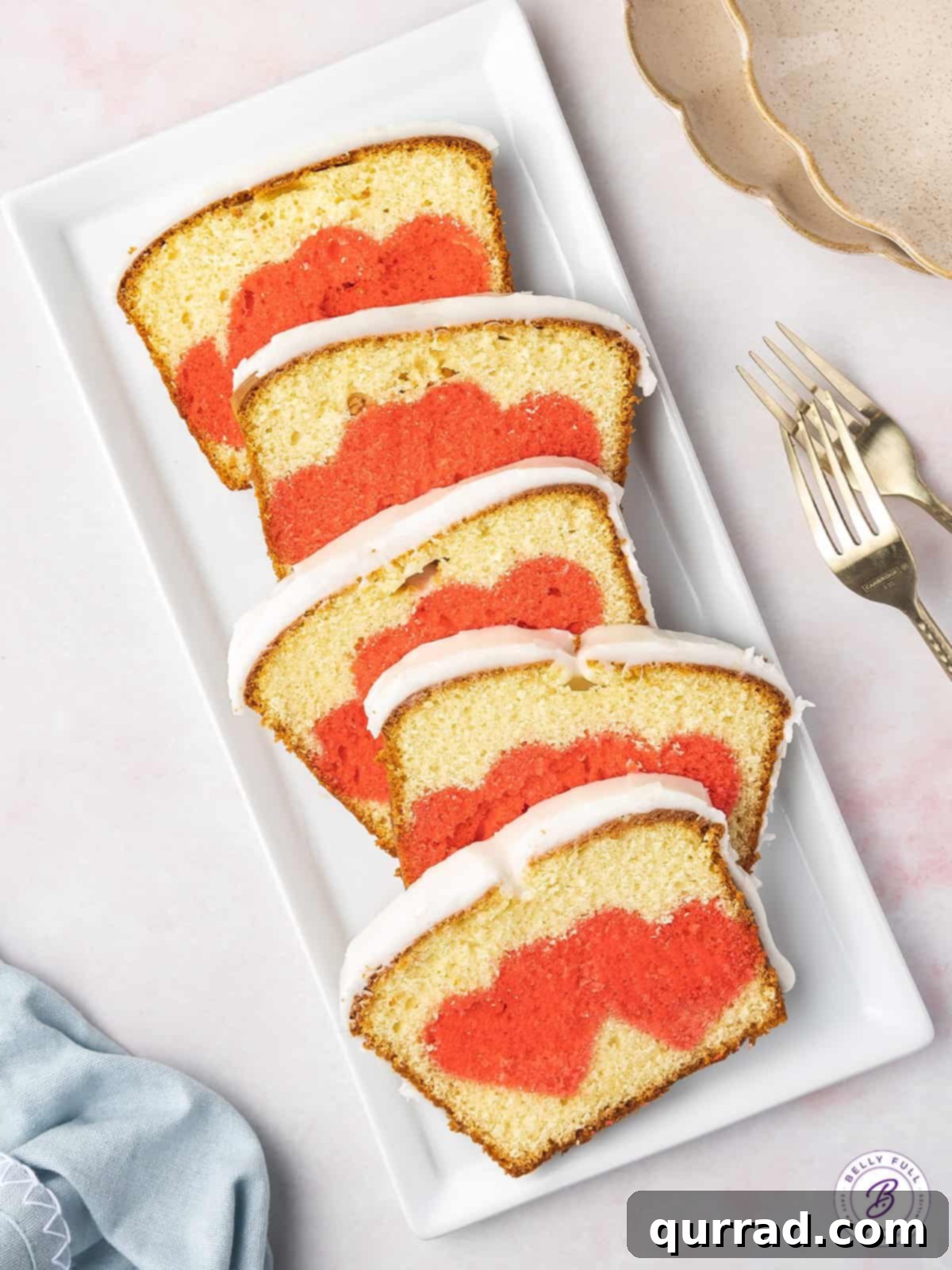 Secret Heart Reveal Cake 6 white serving tray with 5 slices of iced heart pound cake