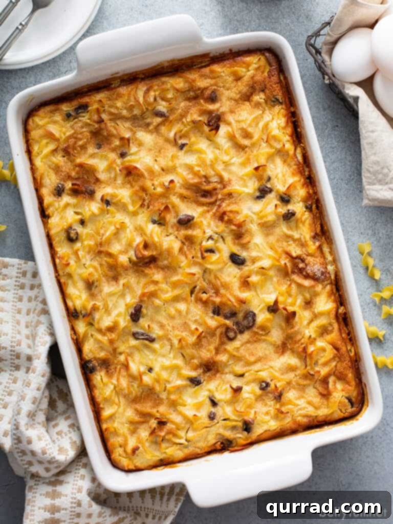 Golden Baked Noodle Pudding 2 Noodle Kugel Casserole in a white casserole dish.