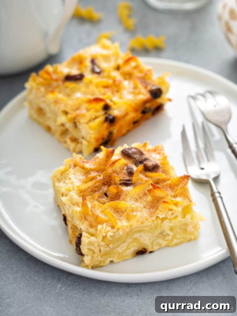 Golden Baked Noodle Pudding 10 Serving of Jewish kugel on a white plate