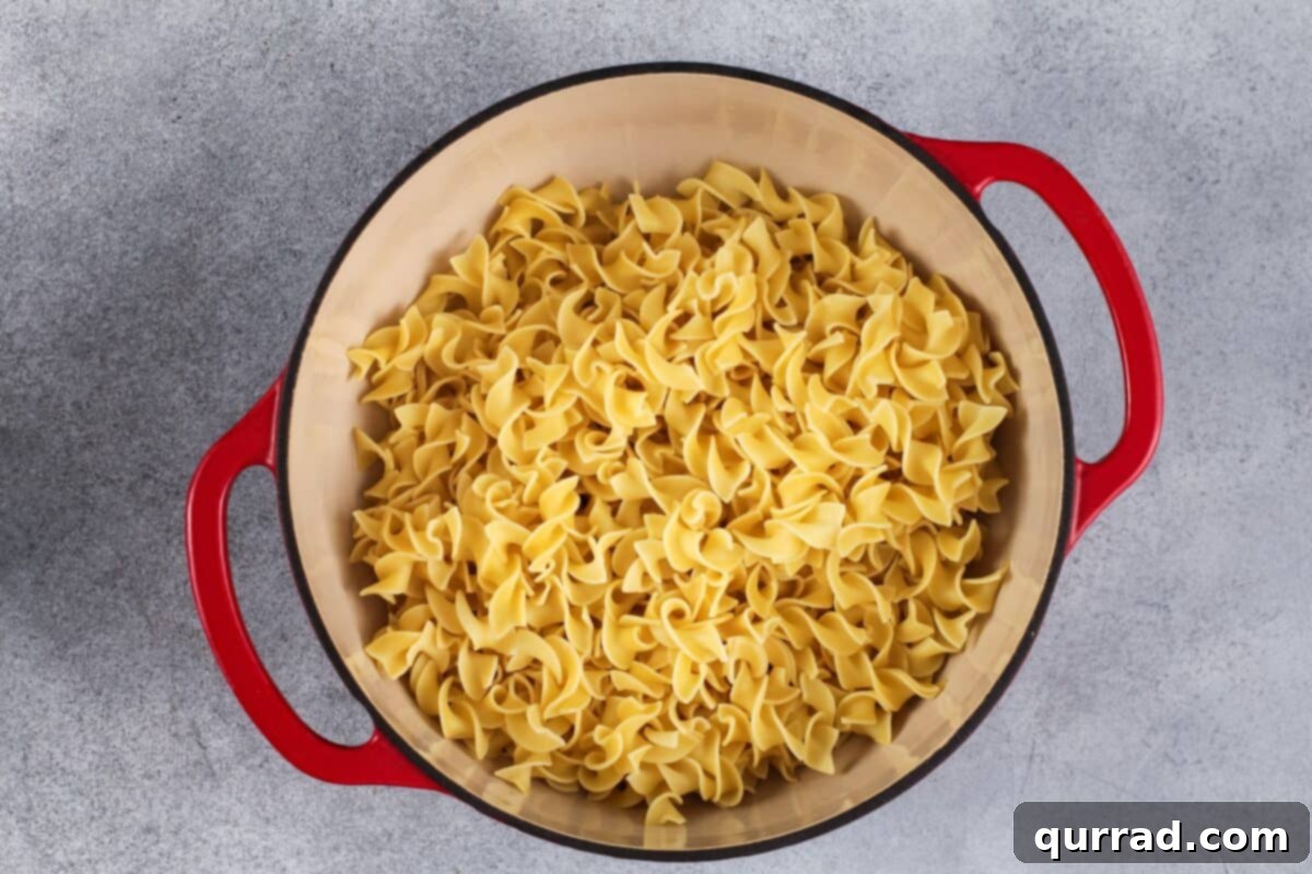 Golden Baked Noodle Pudding 6 Egg noodles in a pot.