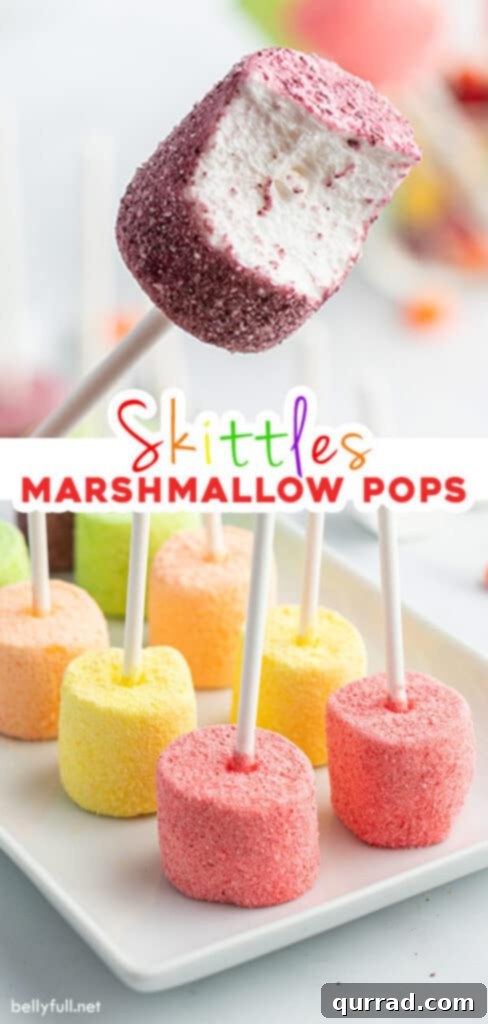 A stunning vertical image showcasing Skittles candy marshmallow pops, perfect for pinning to your favorite dessert boards.