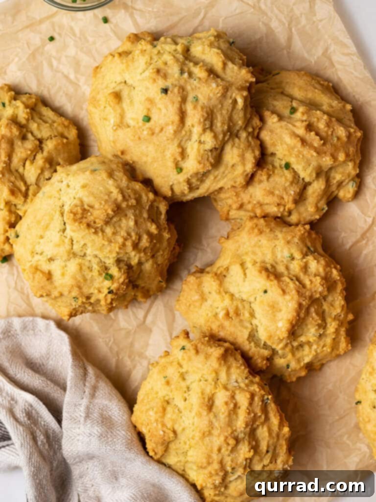 5 golden biscuits piled on brown parchment paper