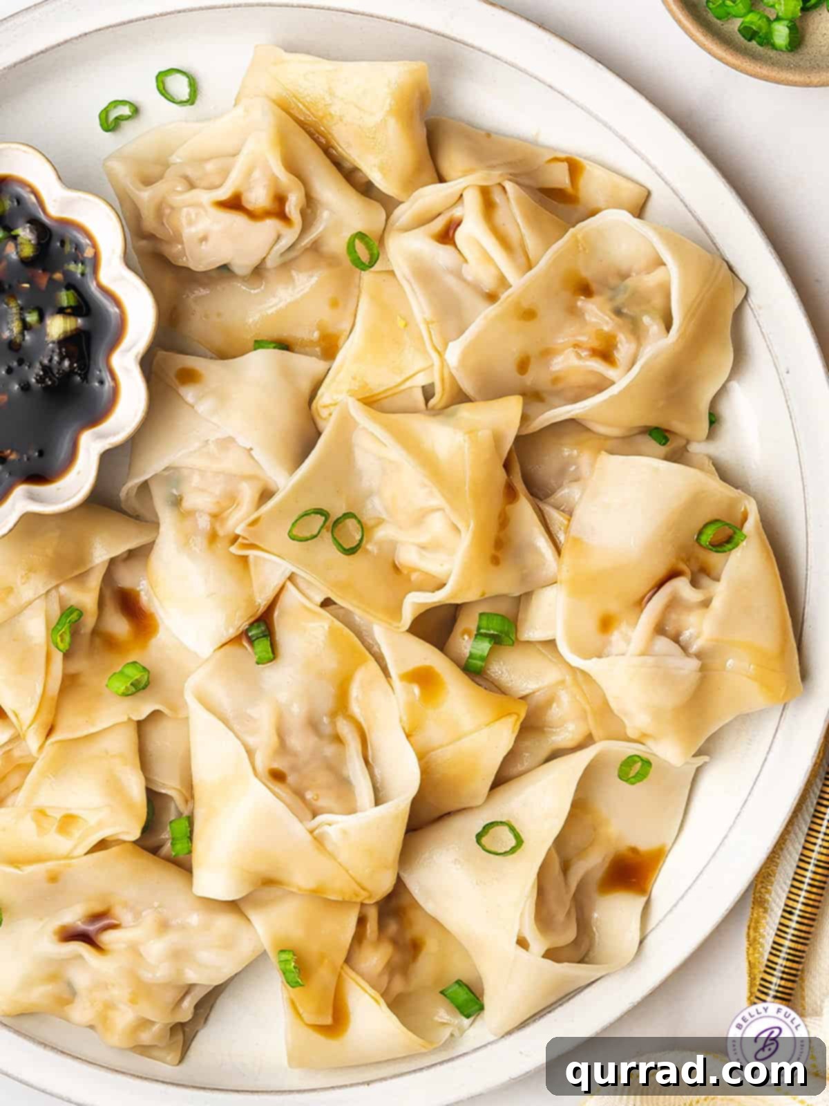 Close-up overhead view of a platter of cooked Chinese pork and shrimp dumplings