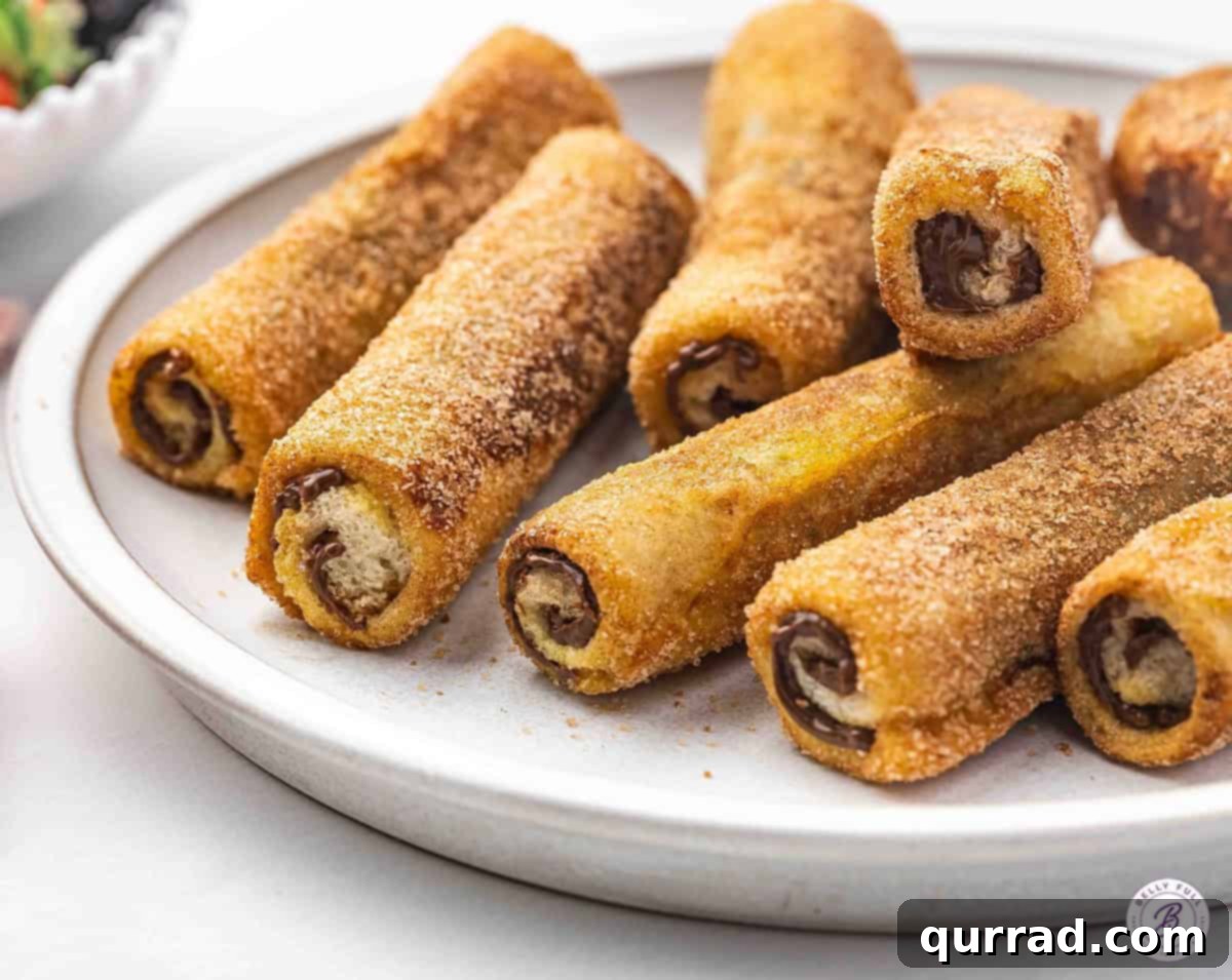 French Toast Rolls coated in cinnamon sugar on plate