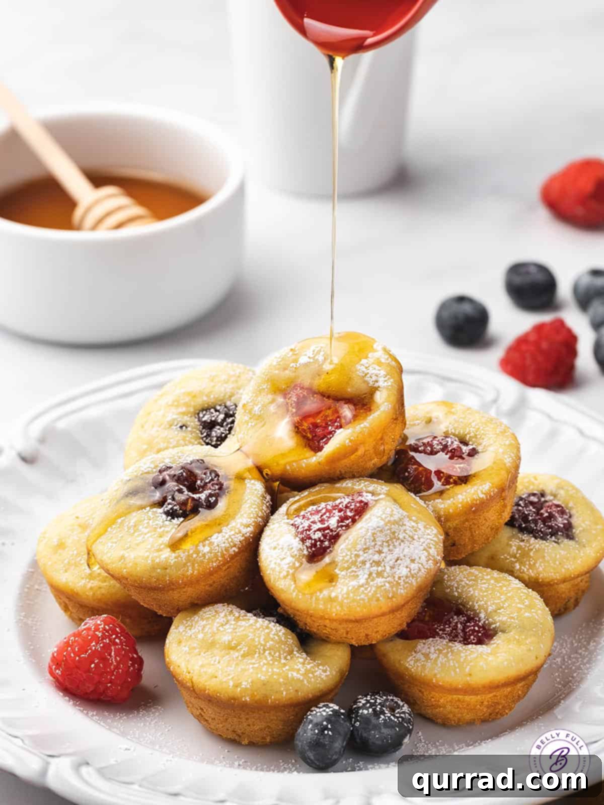 Pancake Poppers 4 maple syrup being drizzled on mini muffins