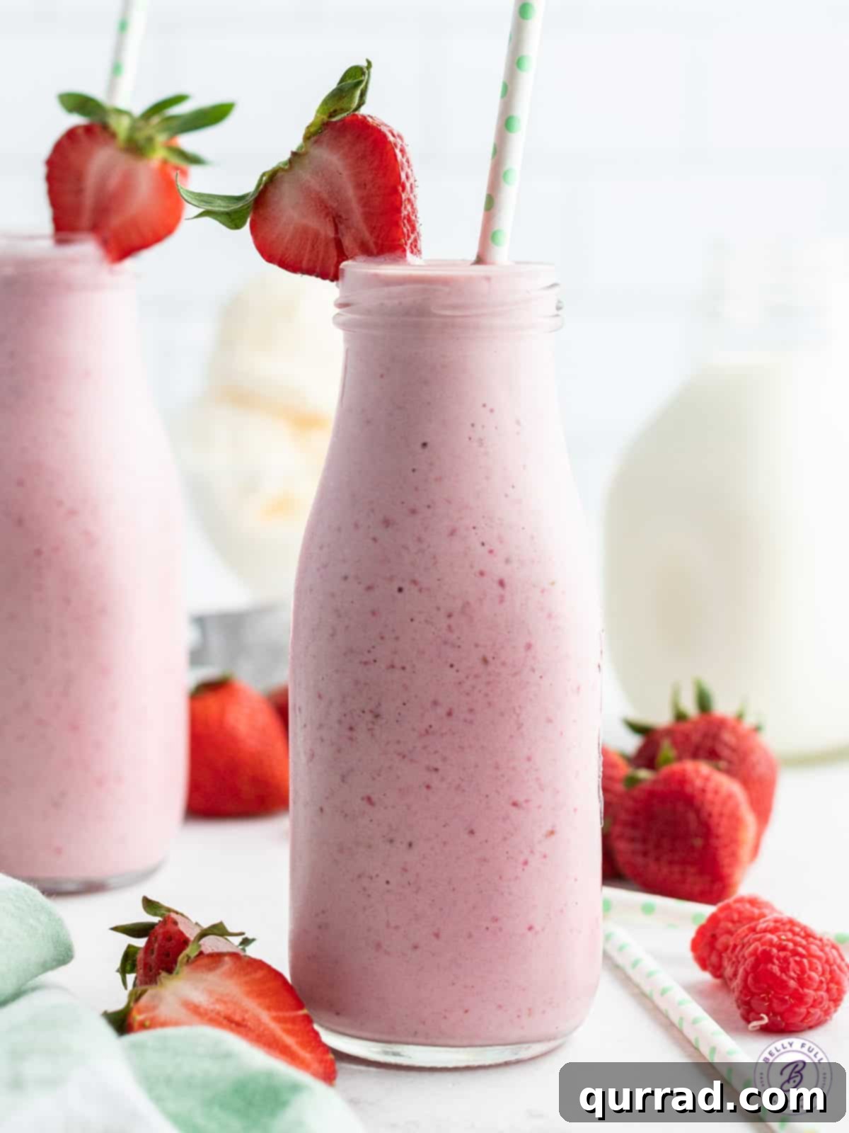 Velvet Strawberry Delight 4 strawberry smoothie in tall glass with straw