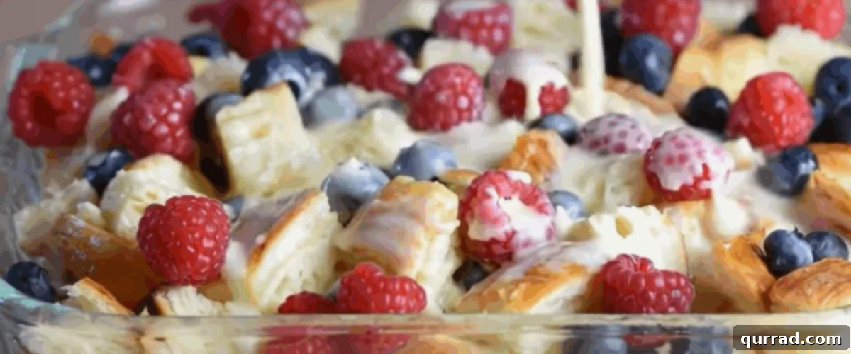 Decadent Croissant Bread Pudding 5 Pouring the custard over the torn up croissants and fruit.