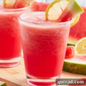 watermelon slushie with watermelon cube and lemon slice