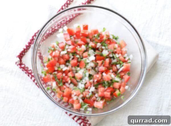 Restaurant-Quality Chipotle Steak Burrito at Home 7 pico de gallo in glass bowl