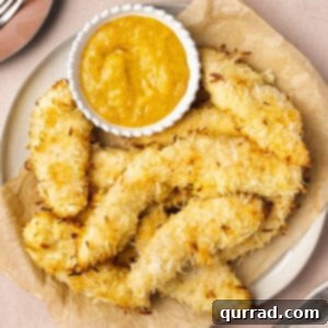 Coconut Crusted Baked Chicken Tenders 6 overhead plate of coconut baked chicken tenders with dipping sauce