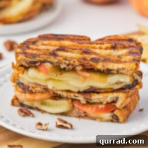 2 stacked halves of roasted apple and brie panini