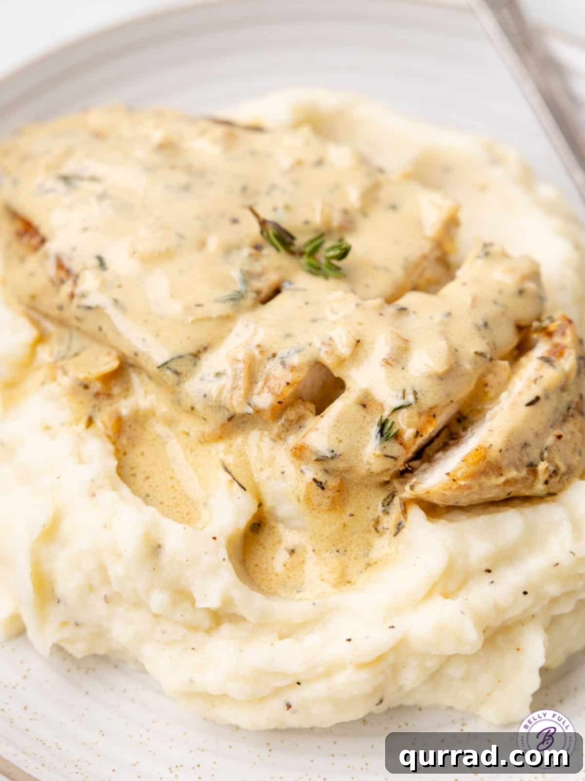 Dijon Chicken 3 cooked sliced chicken with creamy mustard sauce over mashed potatoes