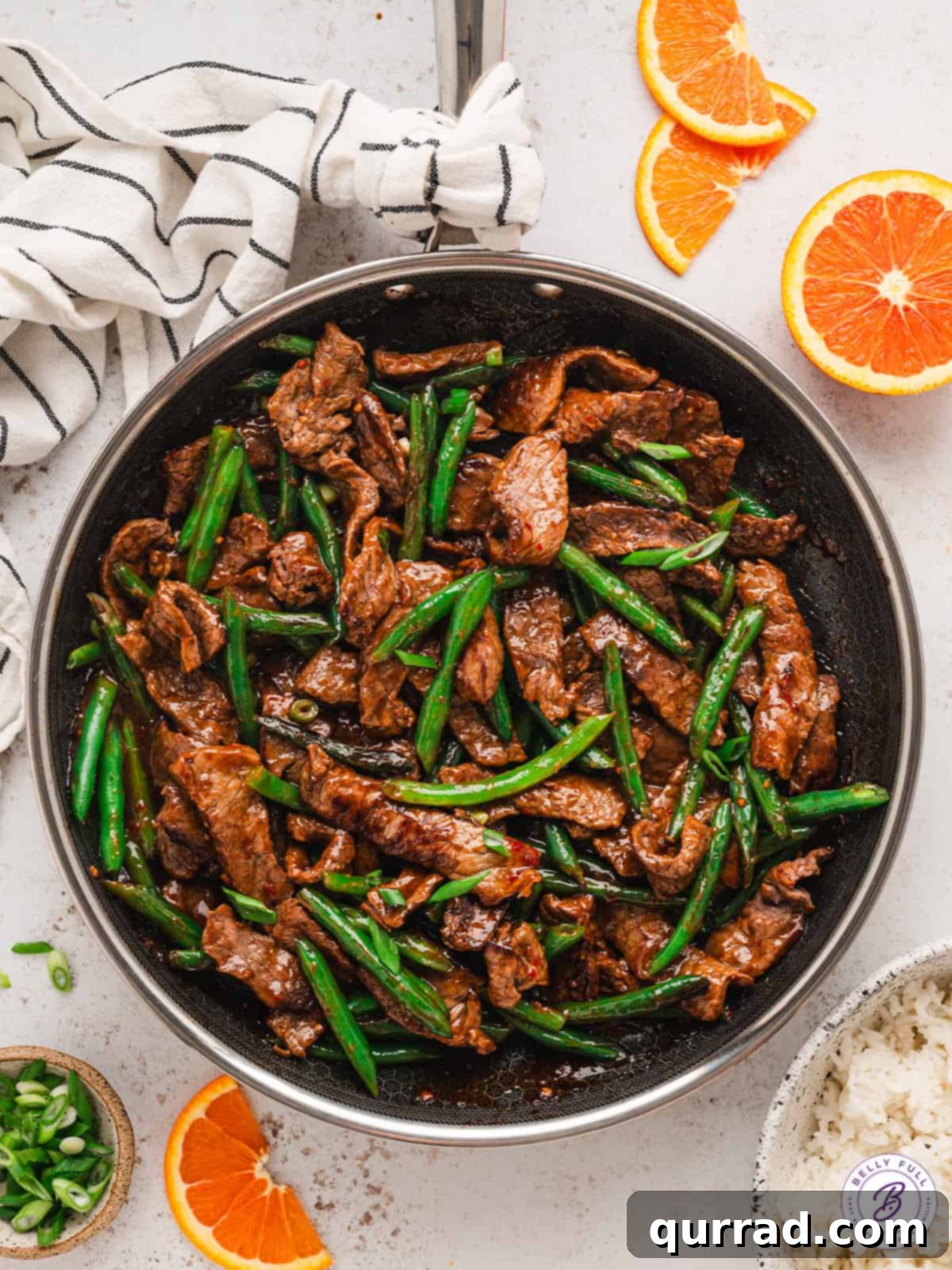 orange beef stir fry in skillet