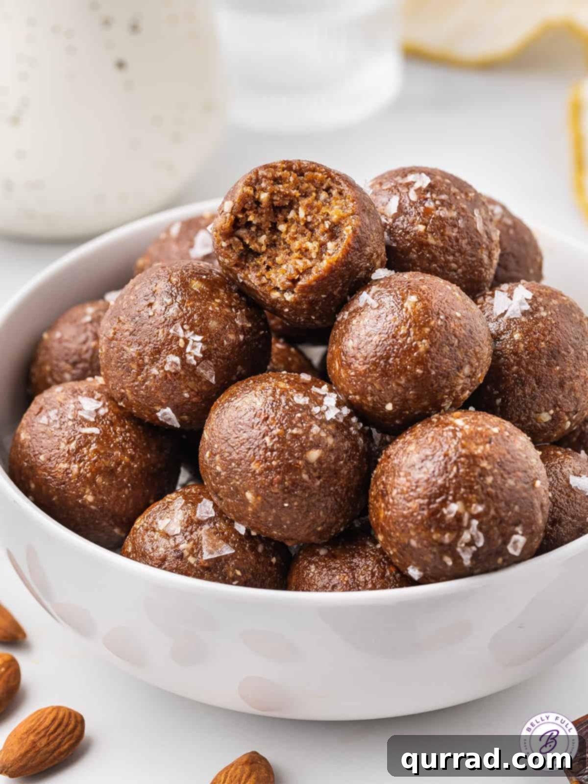 bowl of date balls with bite taken out of one