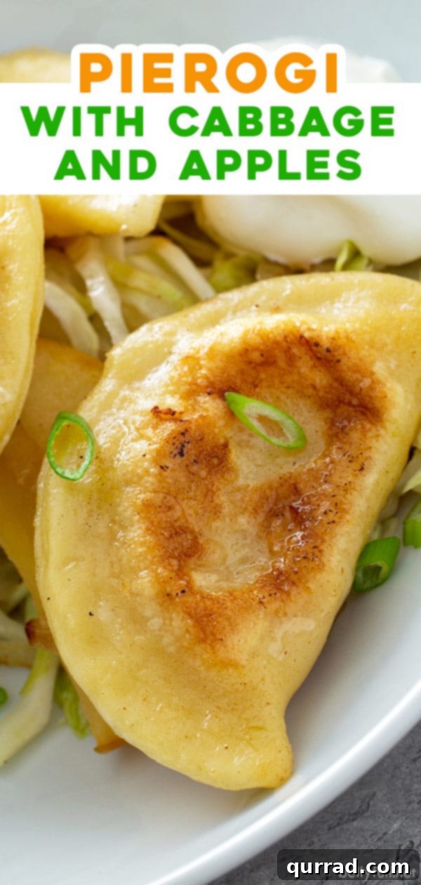 A long Pinterest-friendly image featuring golden pan-fried pierogi topped with a vibrant mix of sautéed cabbage, onions, and apples, perfect for social sharing.