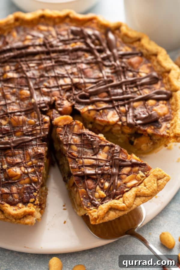 A generous slice of Turtle Pie resting on a metal serving spatula, ready to be served.